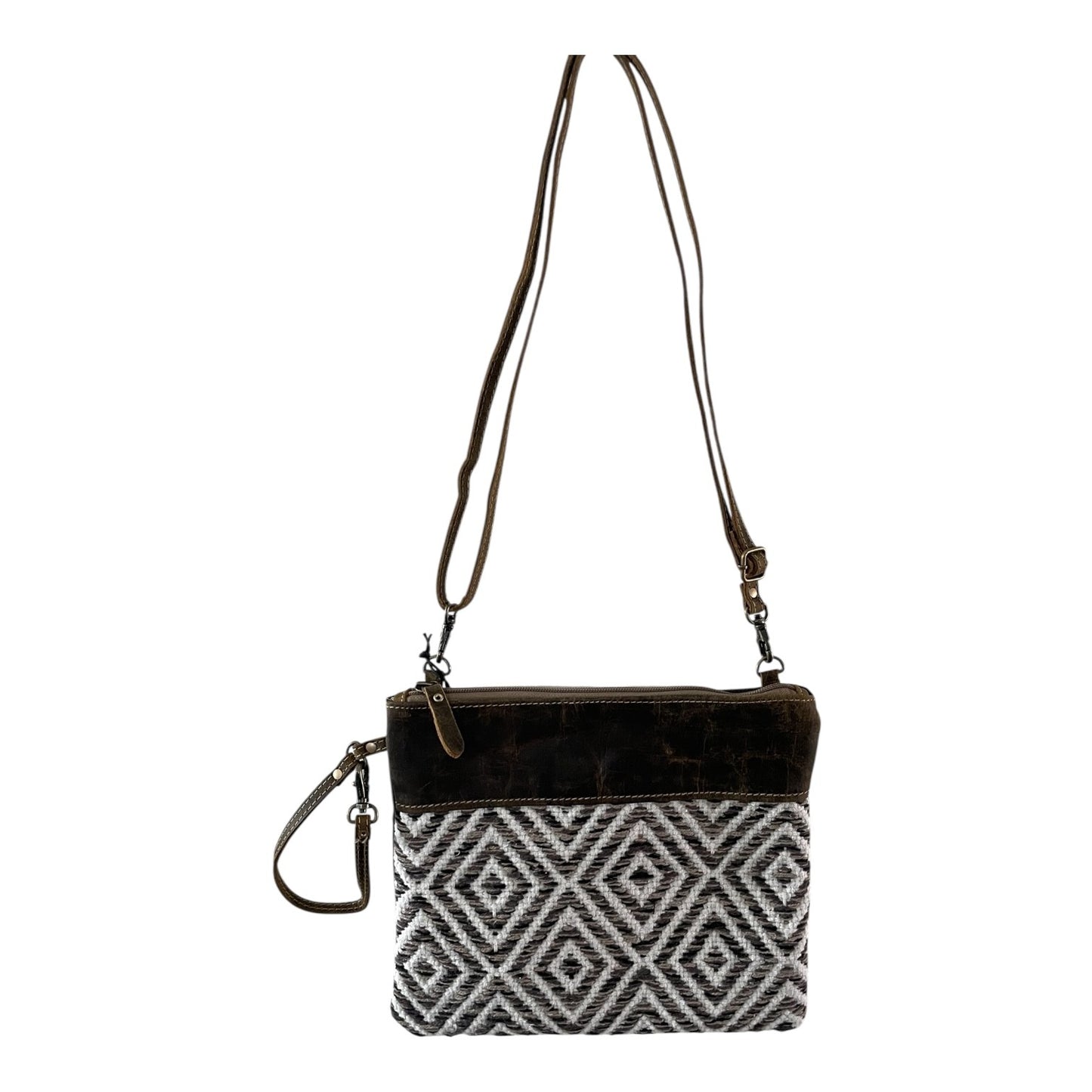 Crossbody bag with black and white patterned pouch on a white background