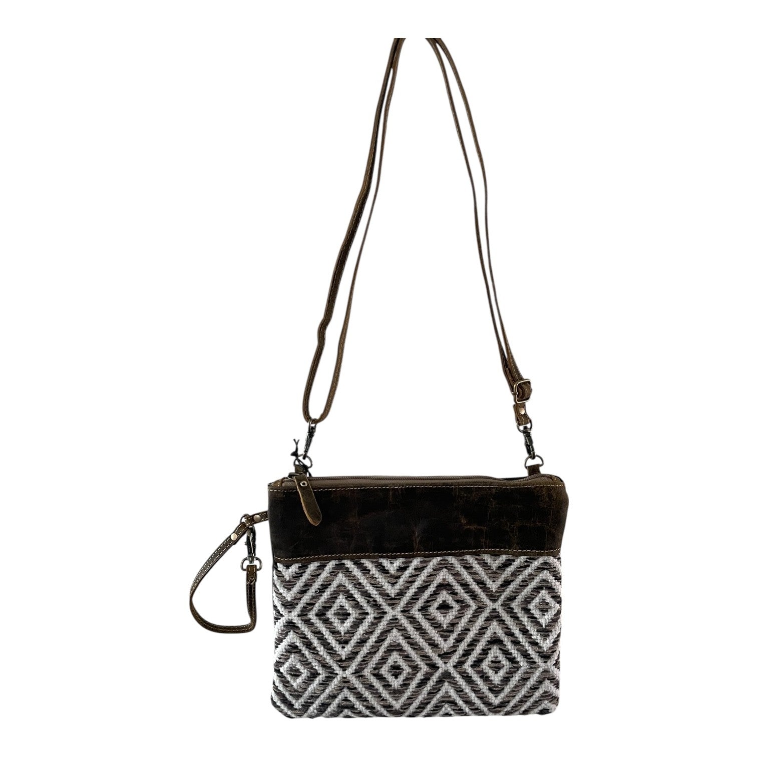 Crossbody bag with black and white patterned pouch on a white background