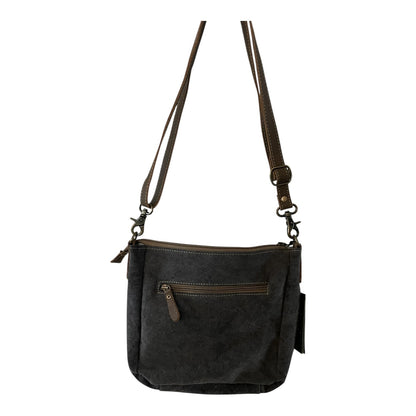 Black crossbody bag with brown straps on a white background