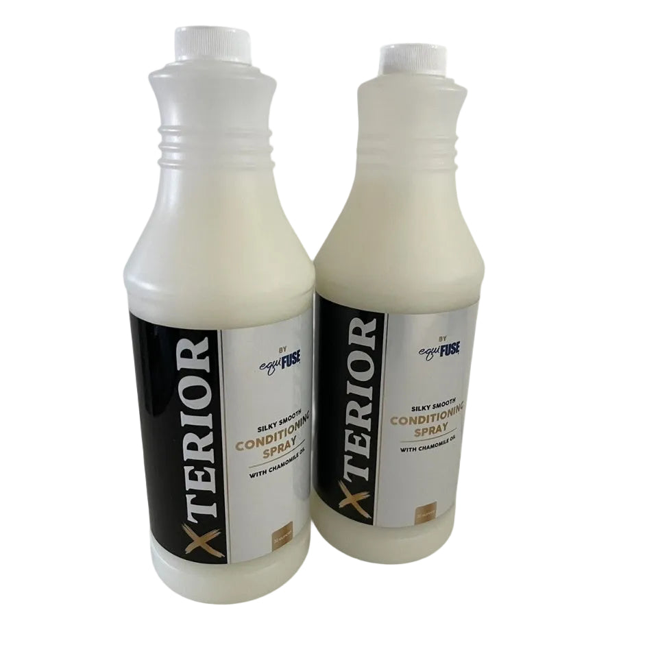 Two bottles of Xterior car care spray on a white background