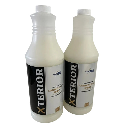 Two bottles of Xterior car care spray on a white background