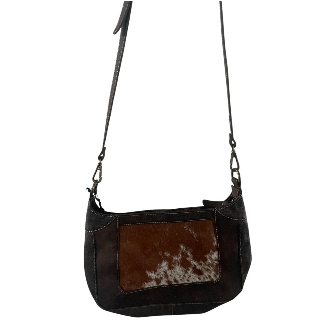 dark brown leather handbag with cowhide pattern on a white background