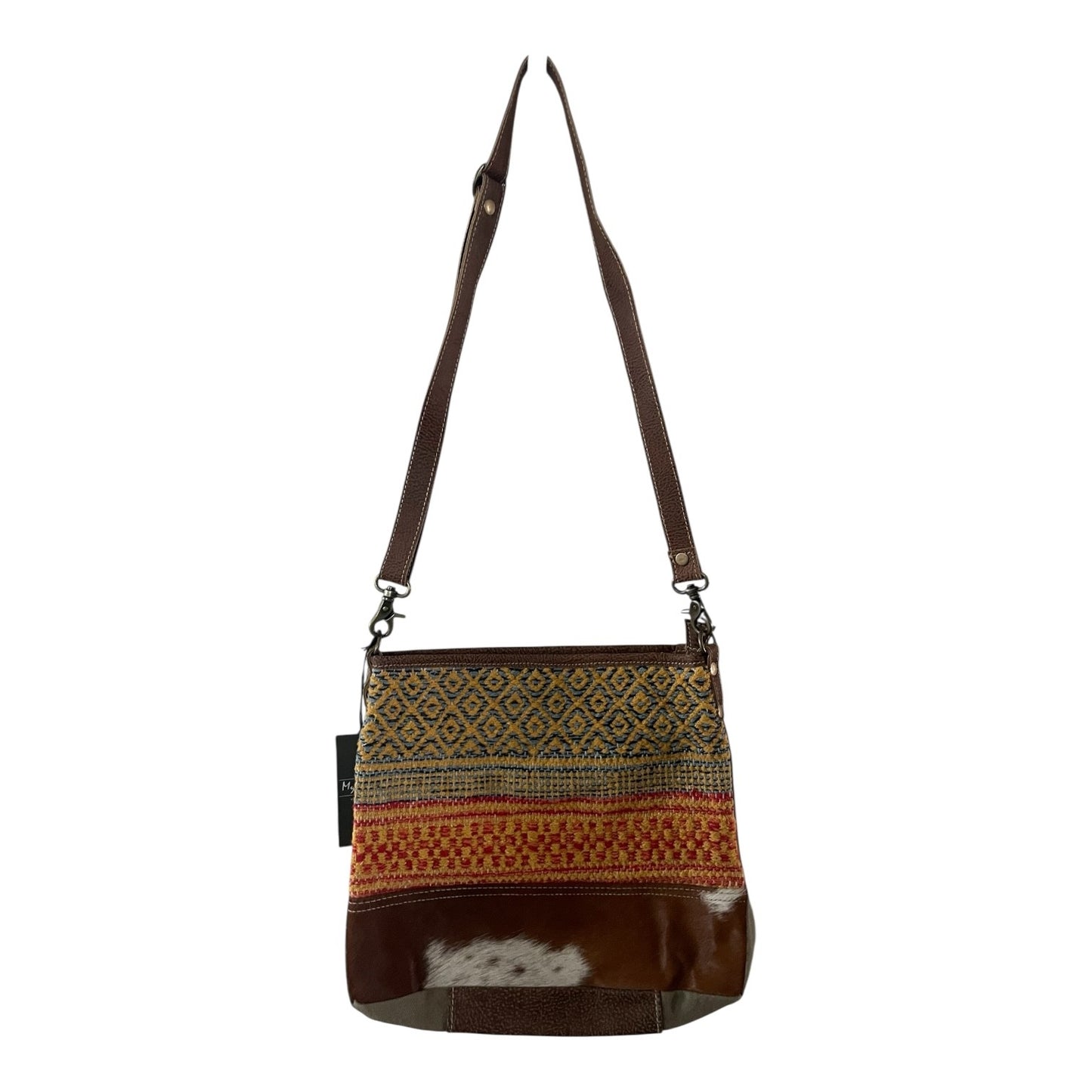 Brown leather crossbody bag with patterned flap on a white background