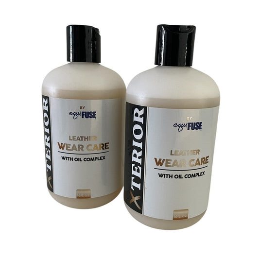 Two bottles of Anterior Leather Wear Care with Oil Complex on a white background