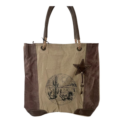 Tote bag with star and cactus design on a beige background