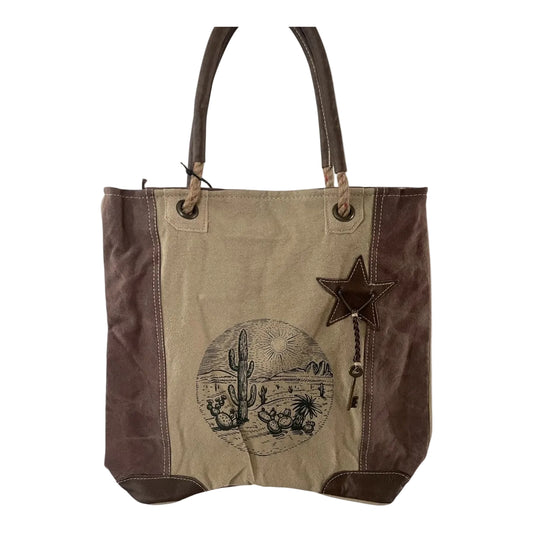 Tote bag with star and cactus design on a beige background
