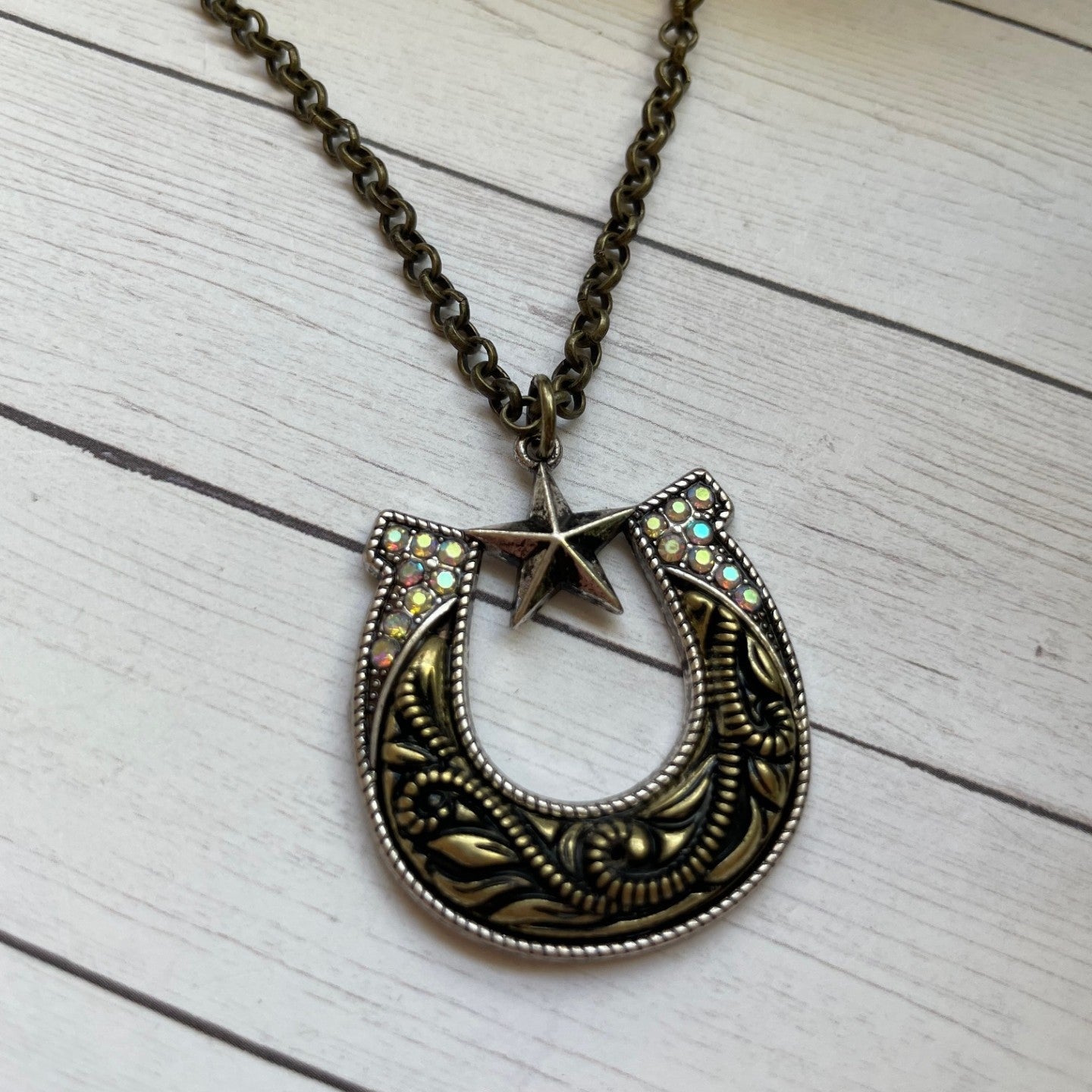 Decorative necklace with a star pendant on a wooden surface