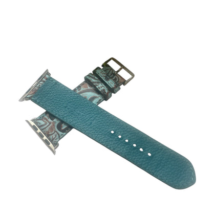 Teal watch strap with floral pattern on a white background