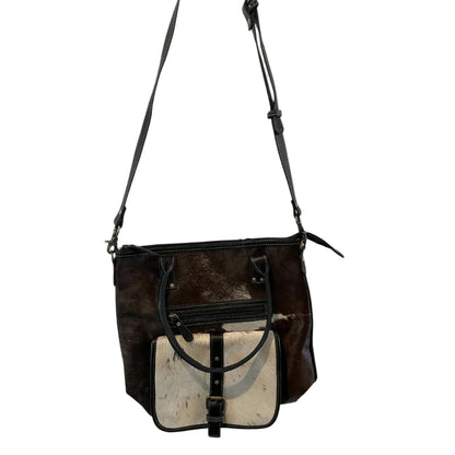 Brown leather handbag with a contrasting interior on a white background