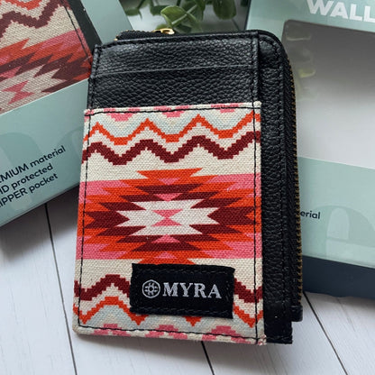 Small wallet with a colorful pattern and 'MYRA' brand logo on a white surface.