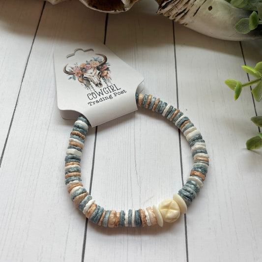 multicolored round pastel colored beads on a stretch bracelet
