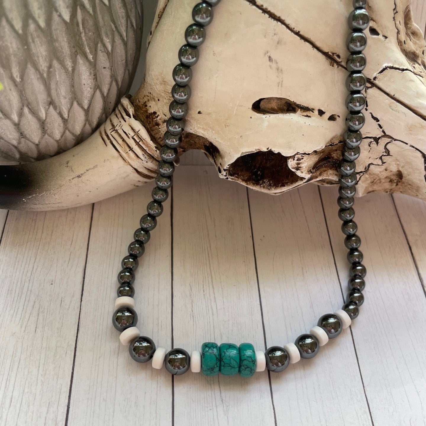Necklace with beads on a wooden surface