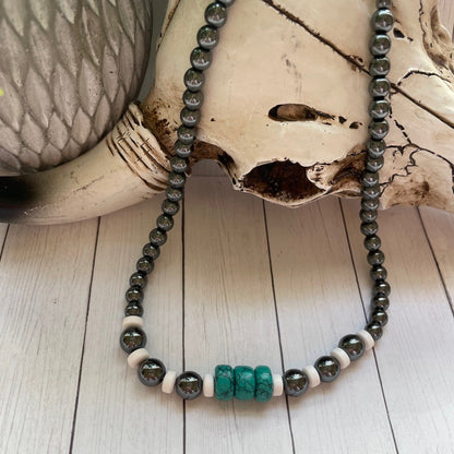 Necklace with beads on a wooden surface