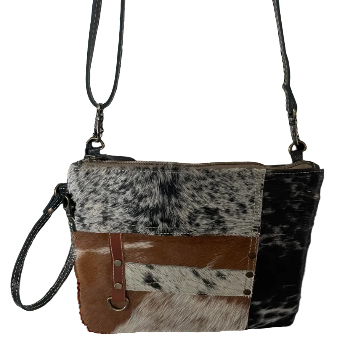 Crossbody bag with cowhide pattern on a white background