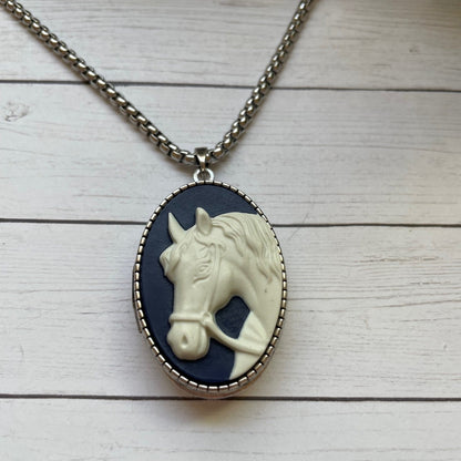 Necklace with a horse pendant on a wooden surface