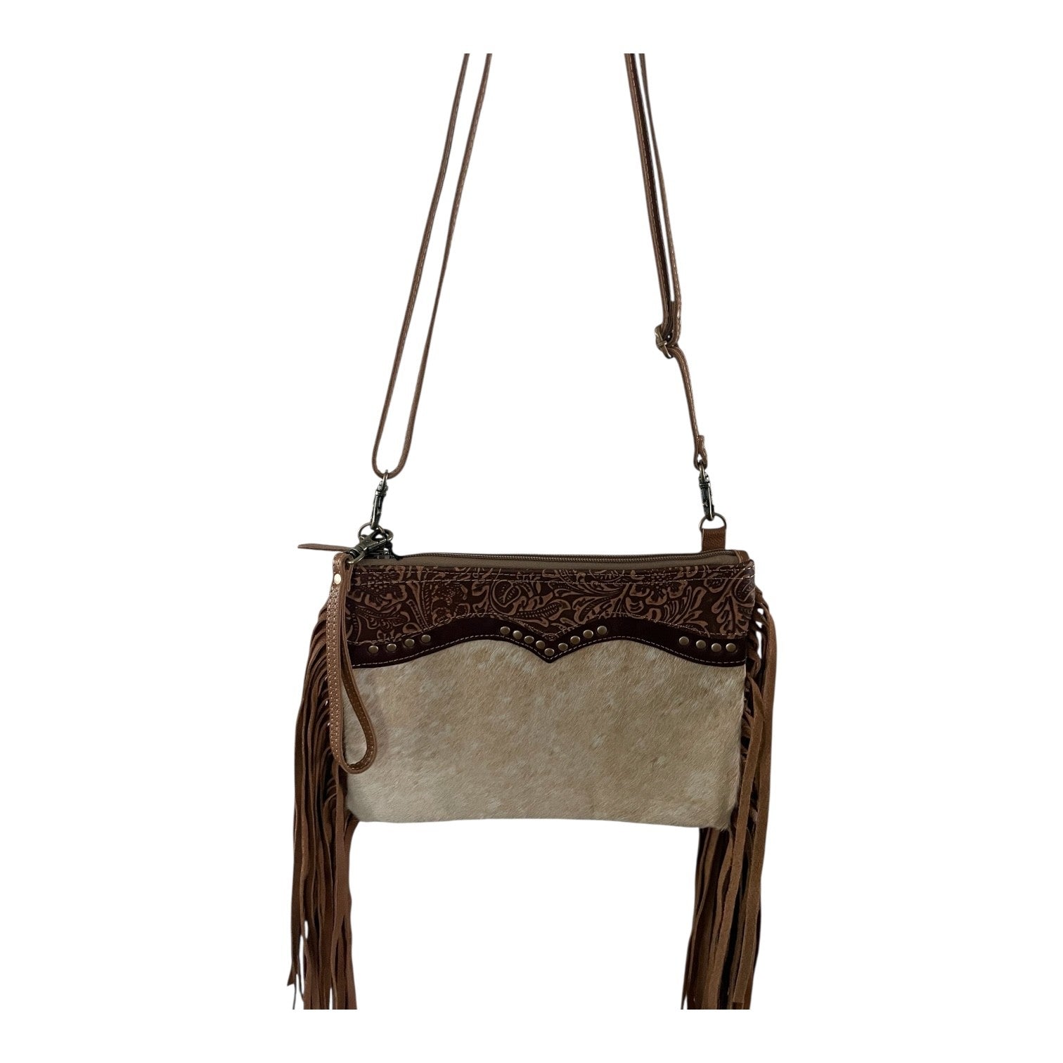 Brown and beige handbag with fringe details on a white background