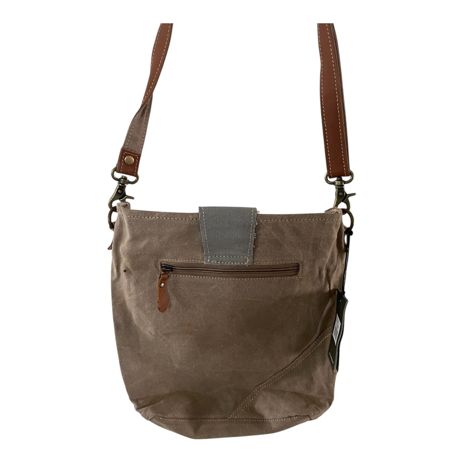 Brown leather crossbody bag with brown straps on a white background