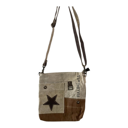 Canvas crossbody bag with star design and text on a white background