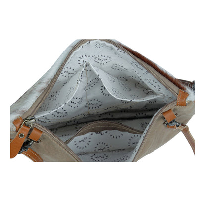 Open beige handbag with brown straps on a white background