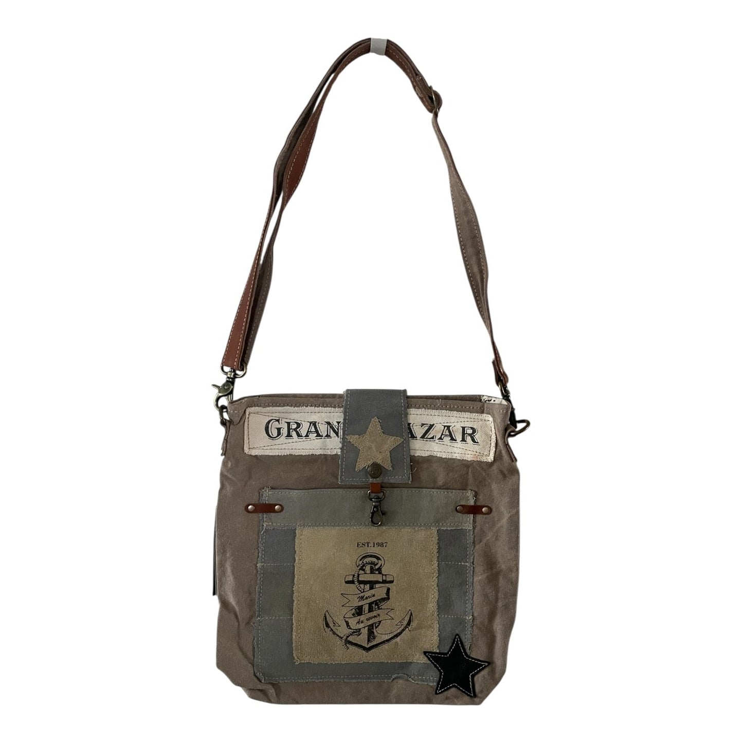 Brown leather bag with star design on a white background