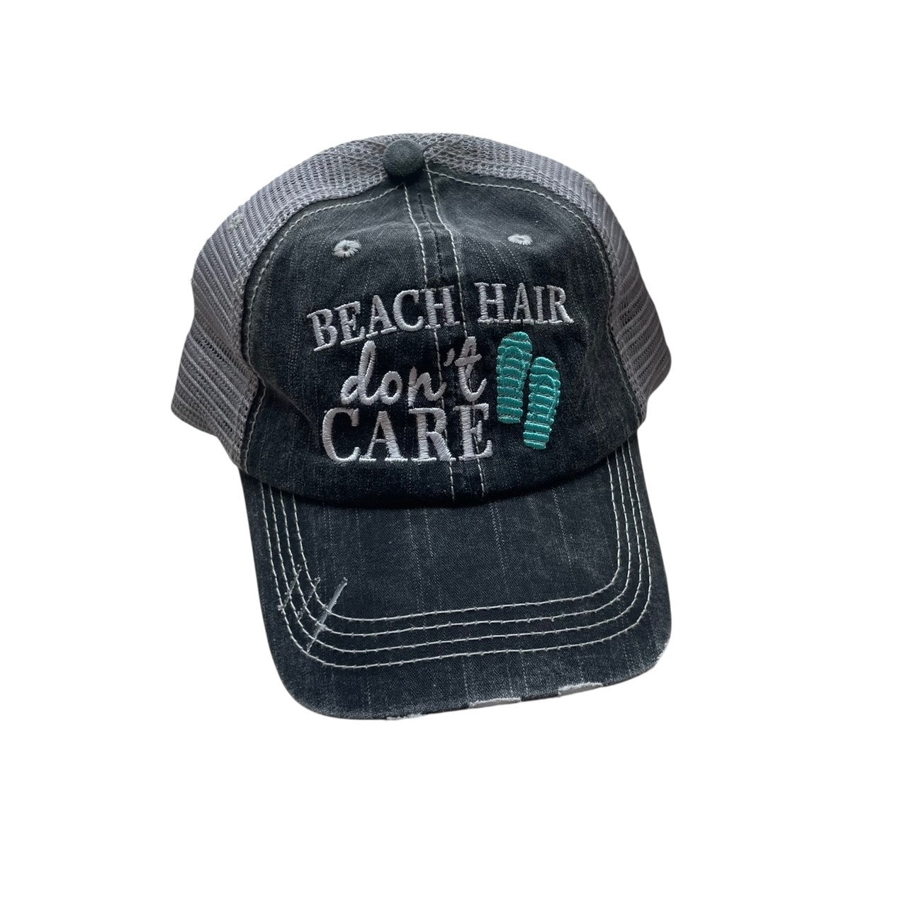 Black cap with 'Beach Hair Don't Care' text and footprints on a white background