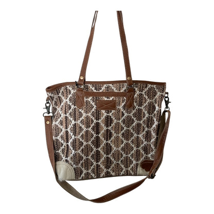 Patterned handbag with brown accents on a white background
