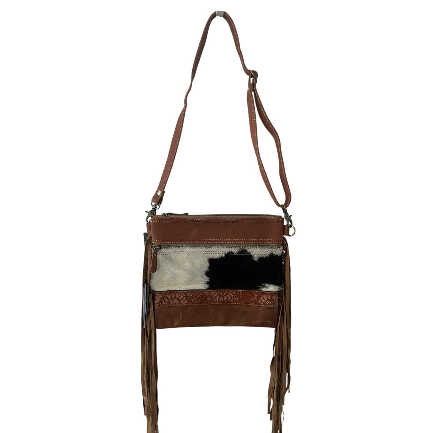 Brown leather handbag with cowhide pattern and fringe details on a white background