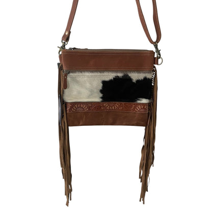 Brown leather crossbody bag with cowhide pattern on a white background