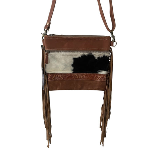 Brown leather crossbody bag with cowhide pattern on a white background