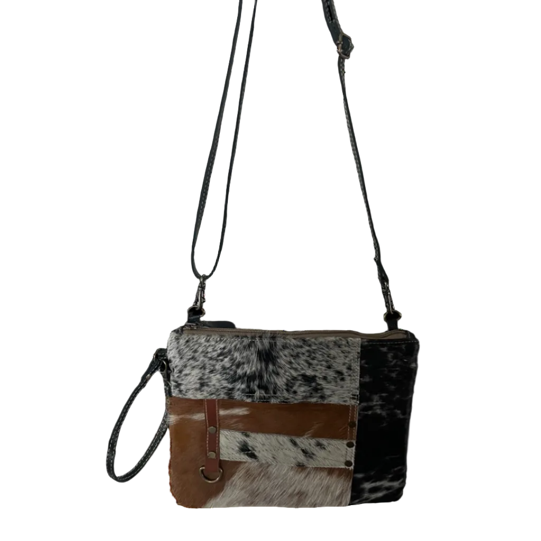 Cowhide leather crossbody bag with brown and black pattern on a white background