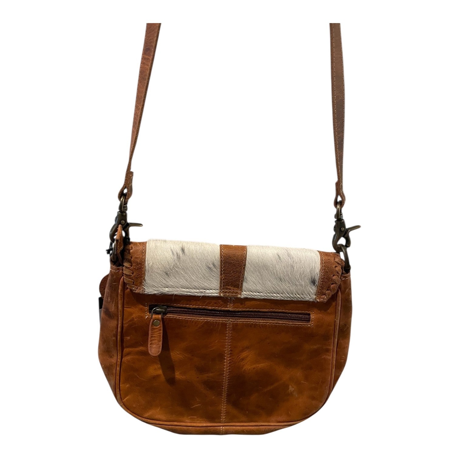 Brown leather handbag with a contrasting white and brown pattern on a white background