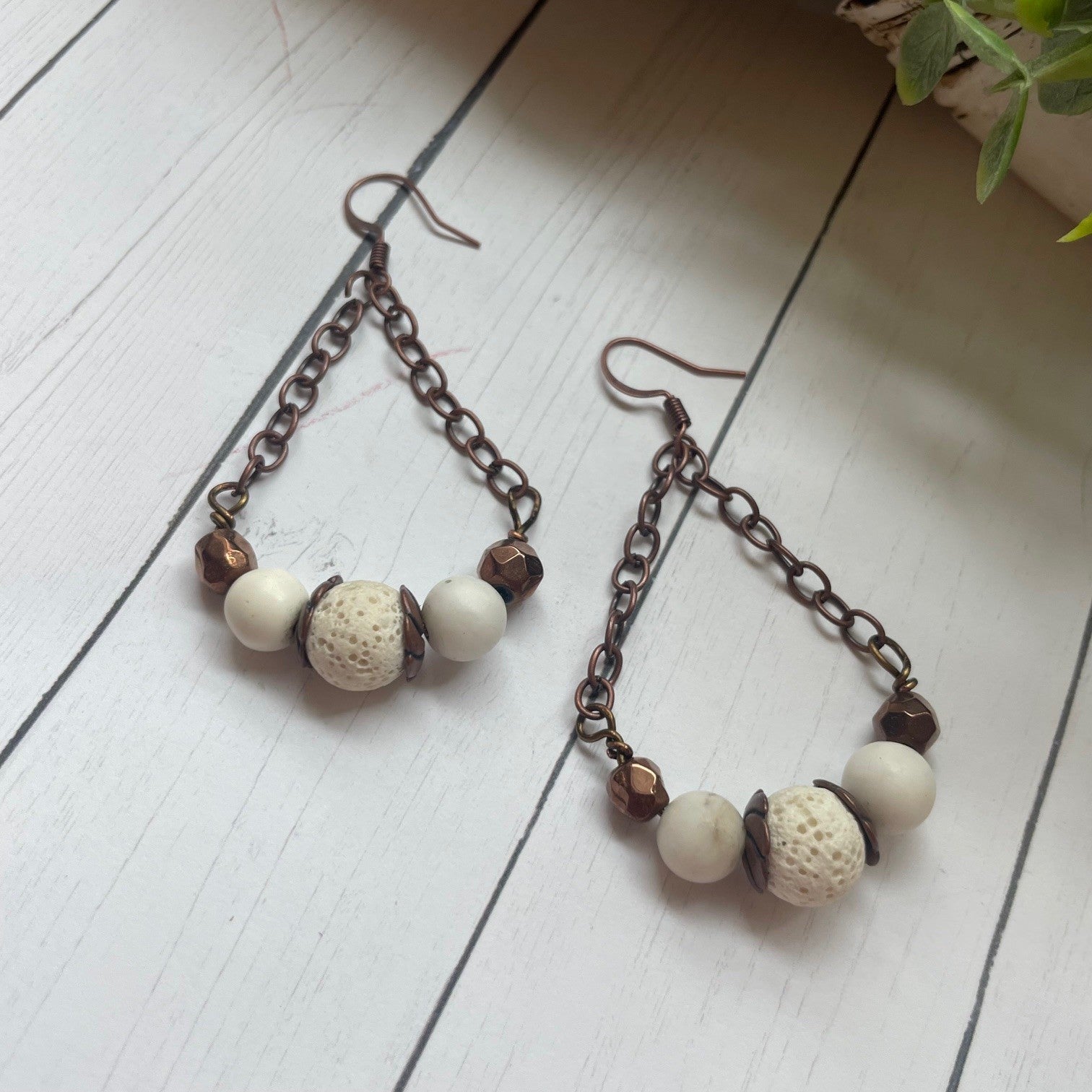 Copper chain and beads and white beads with a white cow or bull skull and greenery
