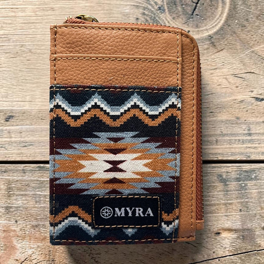 Brown wallet with patterned flap on a wooden surface, featuring the brand 'MYRA'.