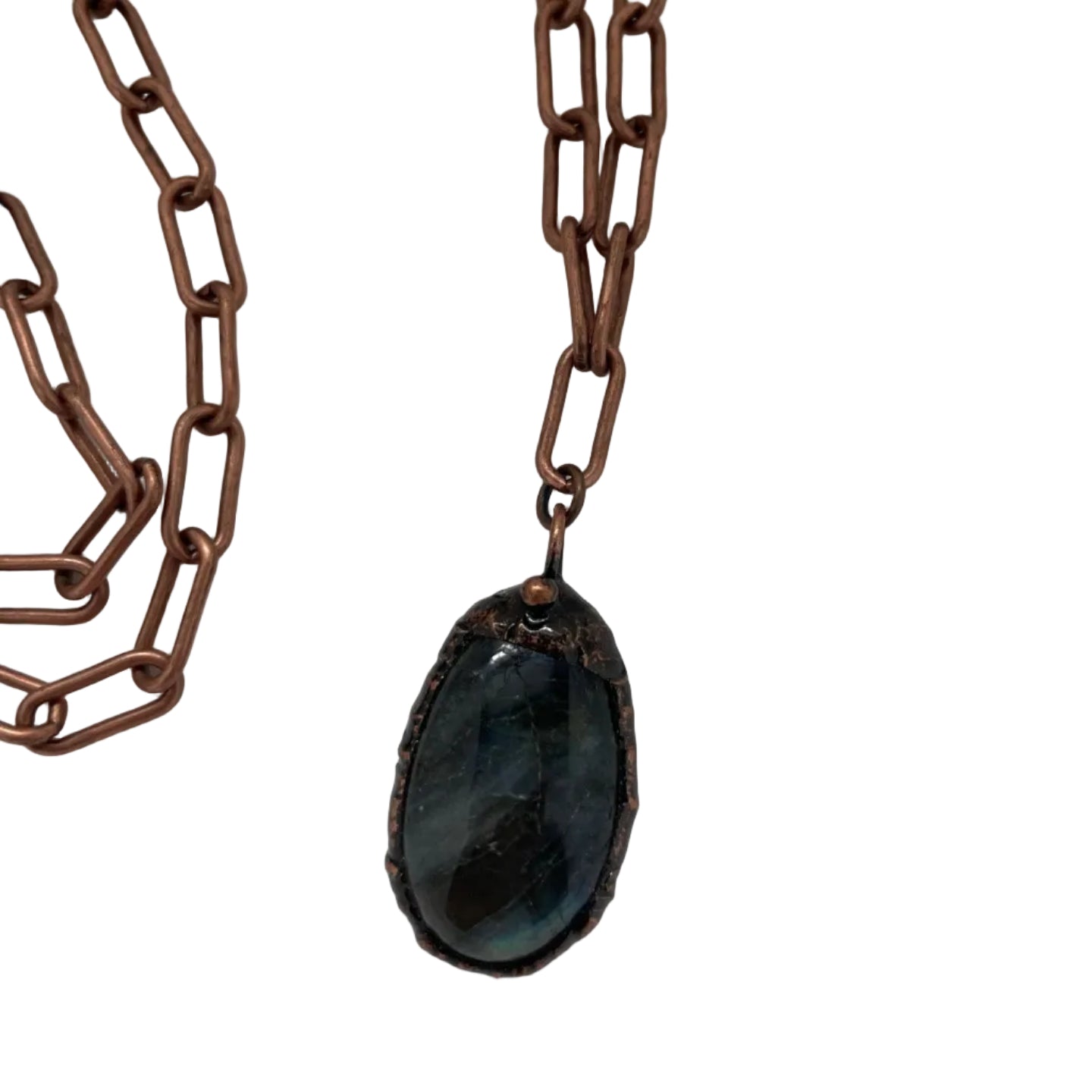 Necklace with a dark stone pendant on a white background