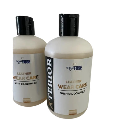 Two bottles of leather care product with visible branding on a white background