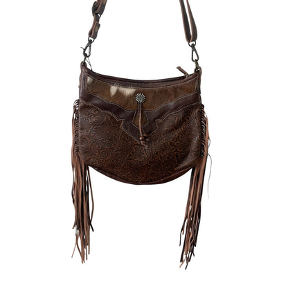 Brown leather handbag with fringe details on a white background