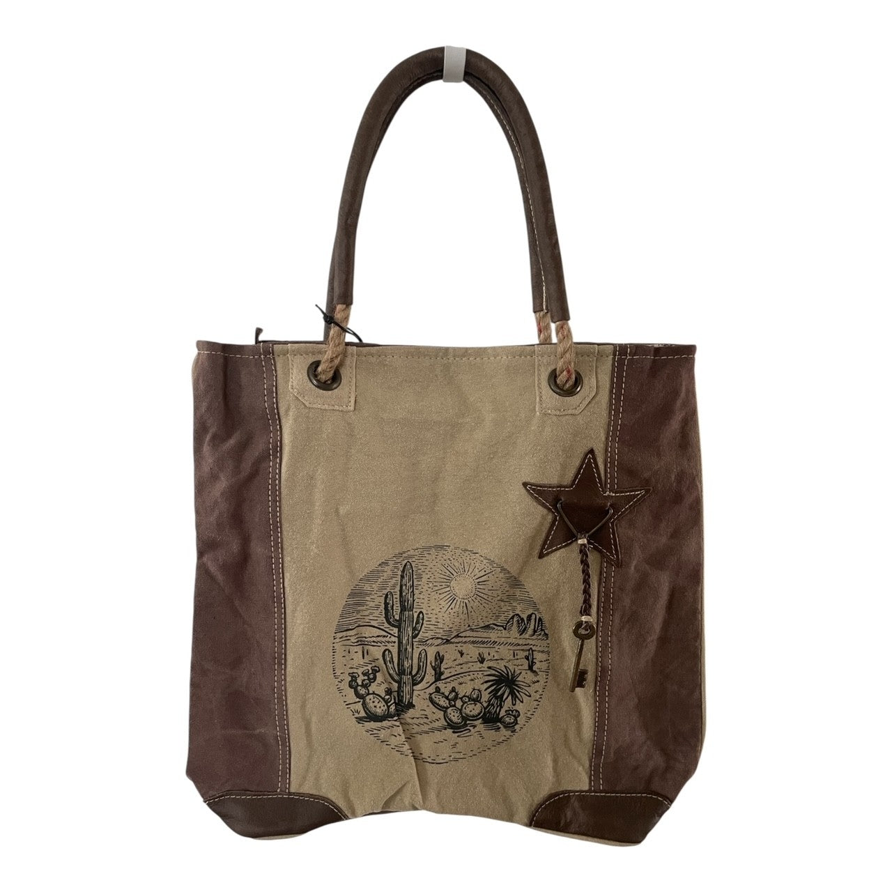 Tote bag with desert scene design and star detail on a white background