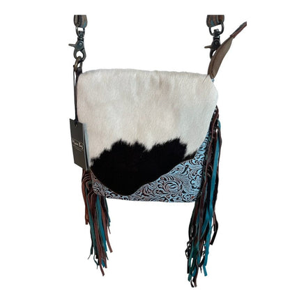 Handbag with white, black, and patterned design on a white background