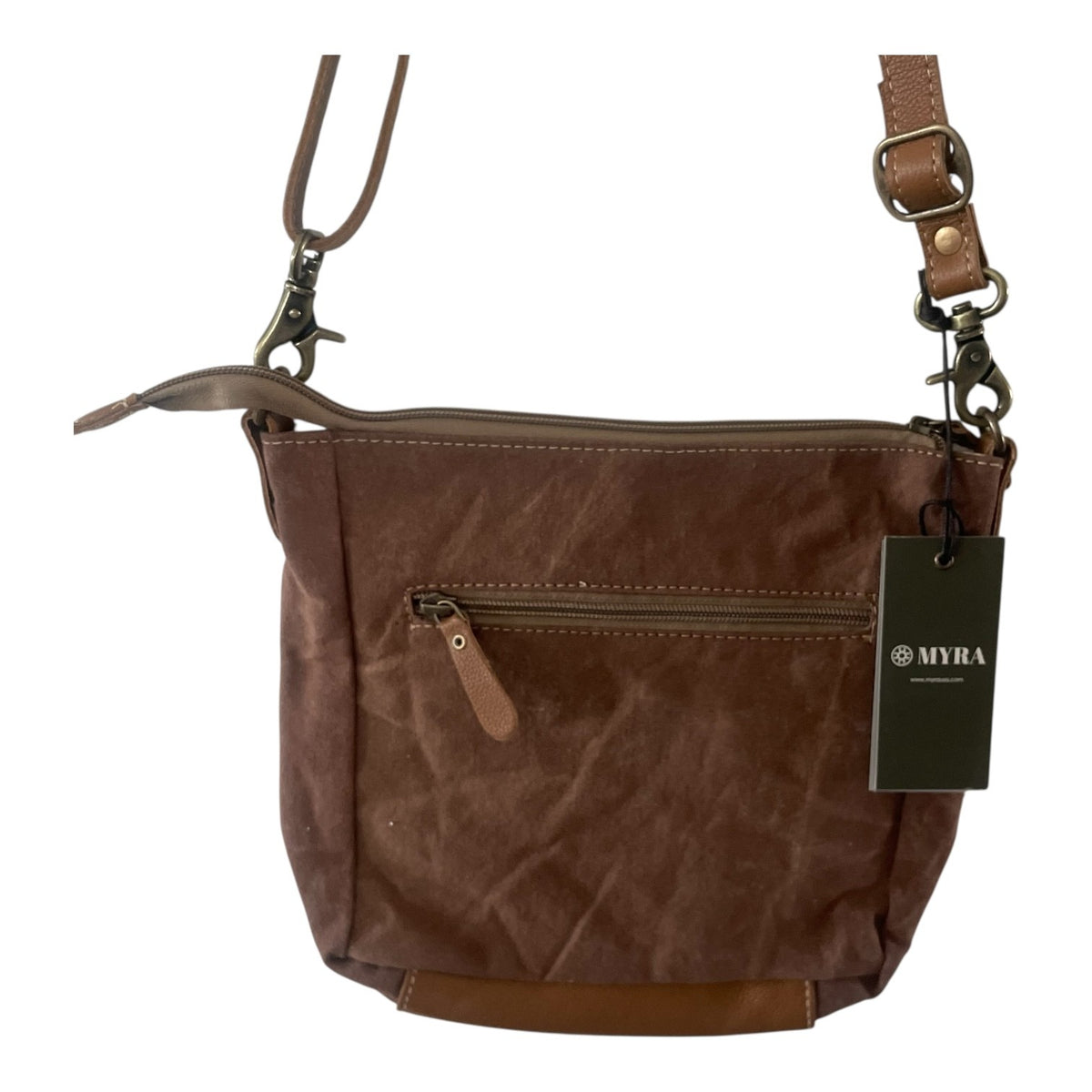 A brown textured canvas crossbody bag with a front zippered pocket, brown leather trim, and a black MYRA brand hangtag, shown on a plain white background.