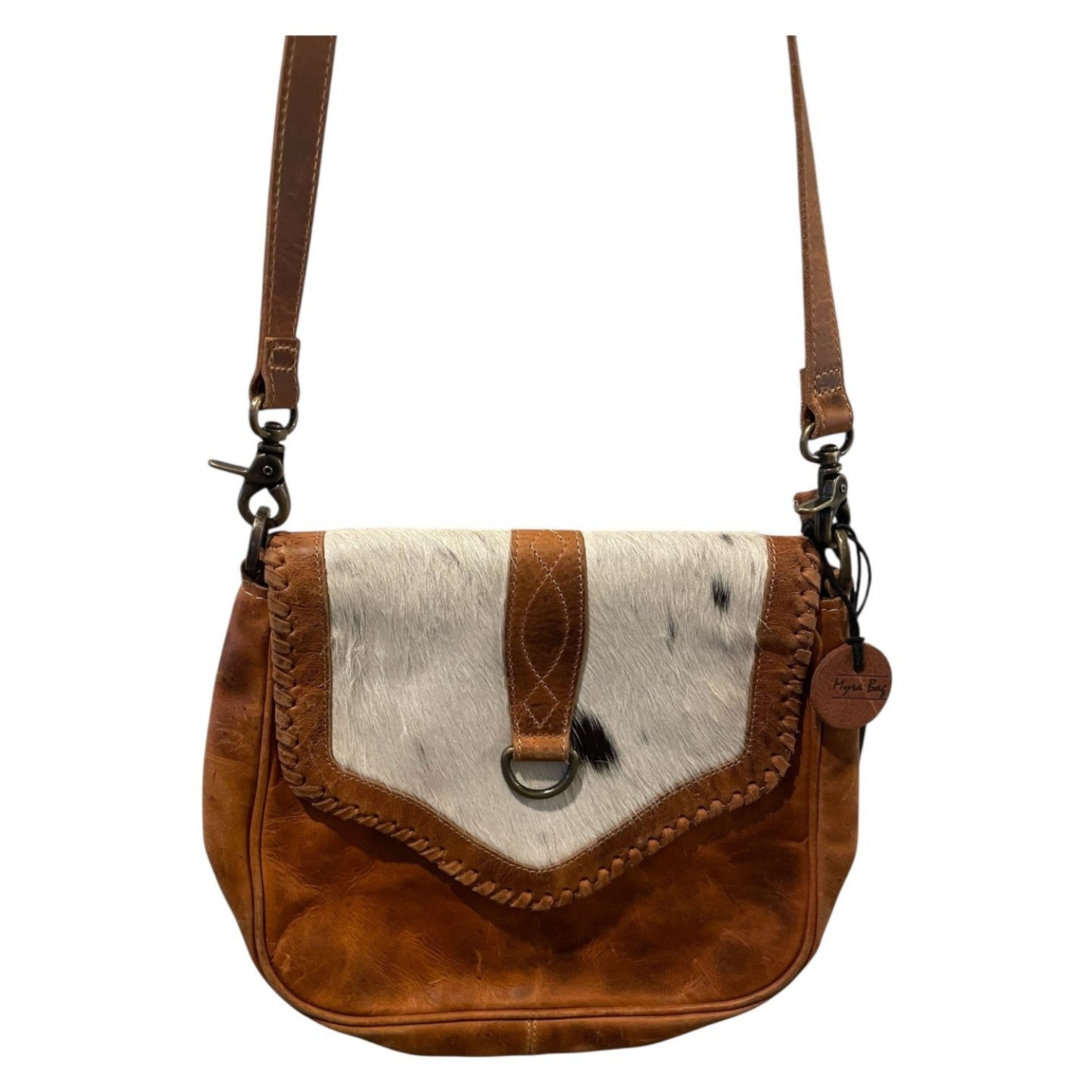 Brown leather and cowhide leather crossbody bag on a white background