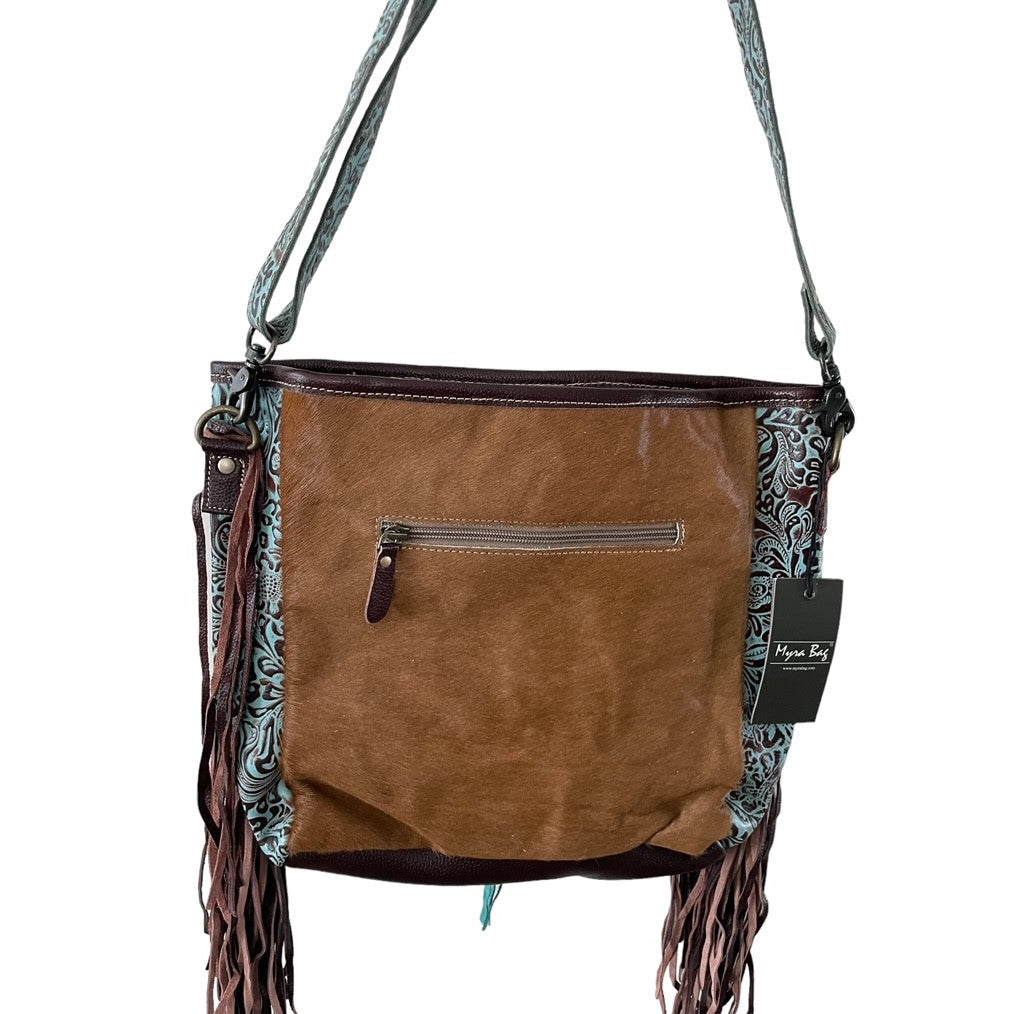 Brown leather handbag with fringe details on a white background