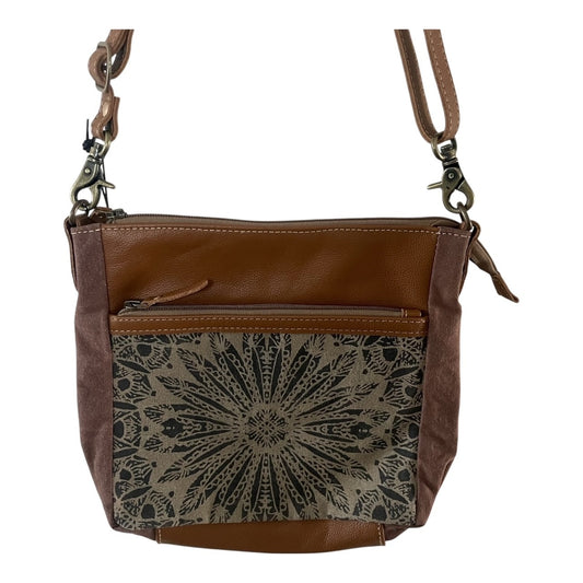 A brown leather crossbody bag with a front zippered pocket featuring a black and beige geometric starburst pattern, shown on a plain white background.