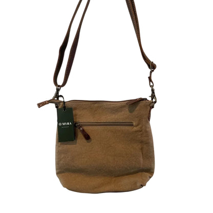 Brown leather handbag with a visible brand tag on a white background