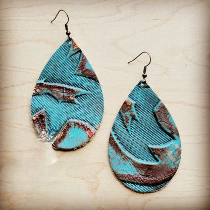 Teal and brown marbled teardrop earrings on a light wood background