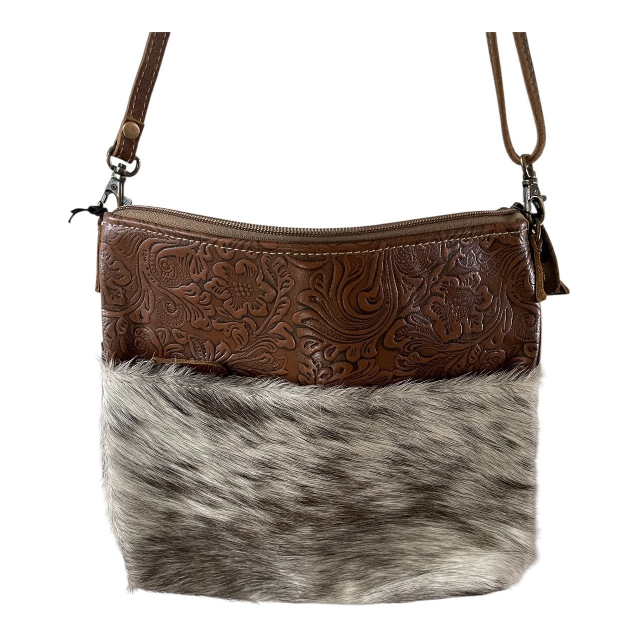 Brown leather and fur handbag on a white background