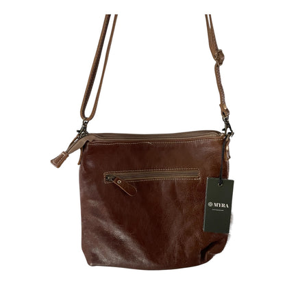 Brown leather handbag with a visible brand tag on a white background