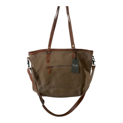 Brown handbag with leather straps on a white background