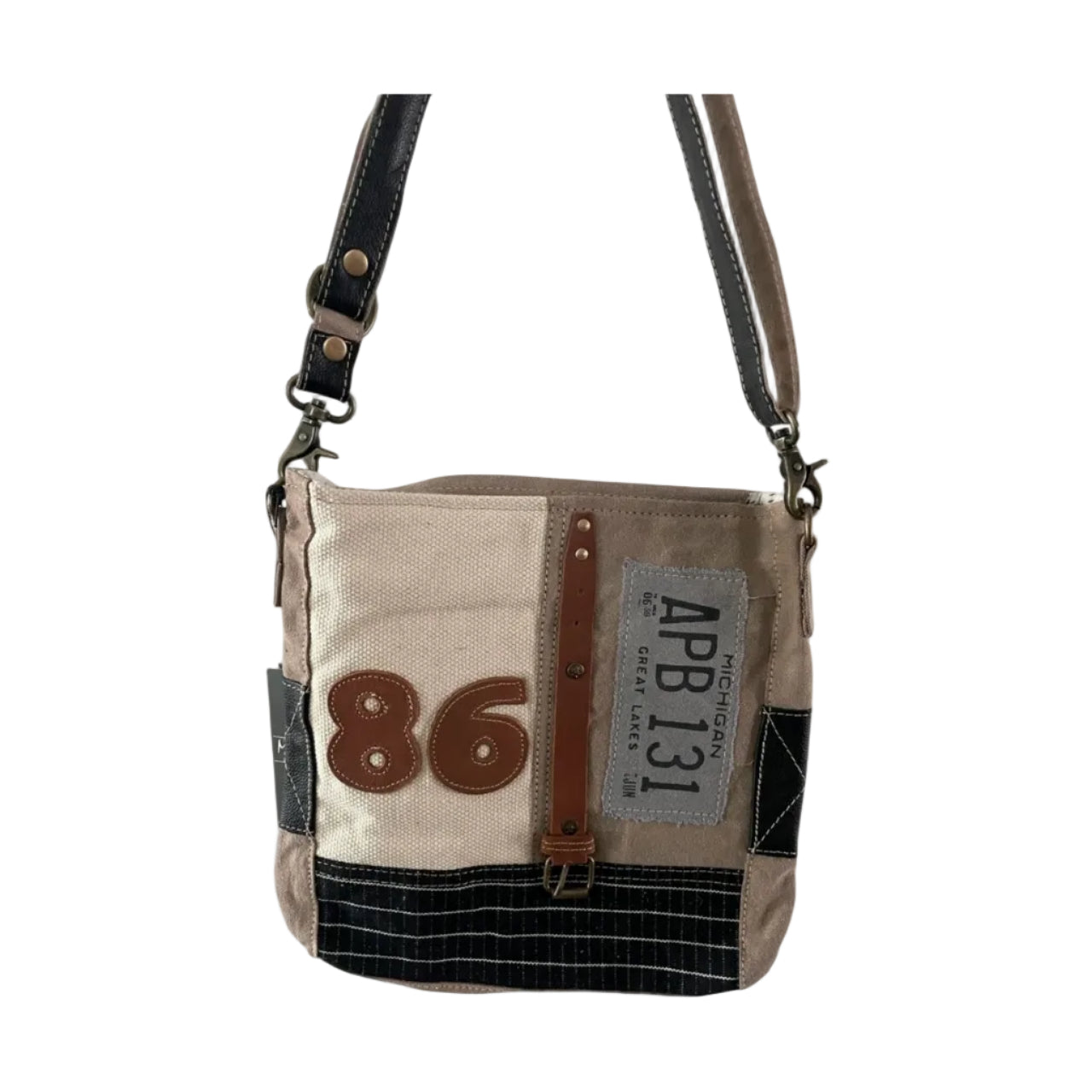 Beige crossbody bag with leather accents and visible brand label on a white background