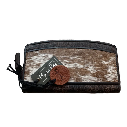 Brown and white cowhide wallet with a visible brand tag on a white background