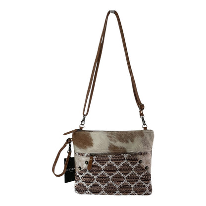 Brown and beige patterned handbag with a strap on a white background